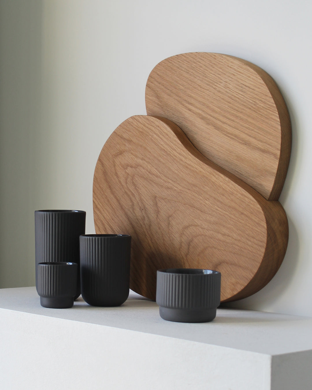Minimalist dark grey Cappuccino mug Column by Archive Studio on table