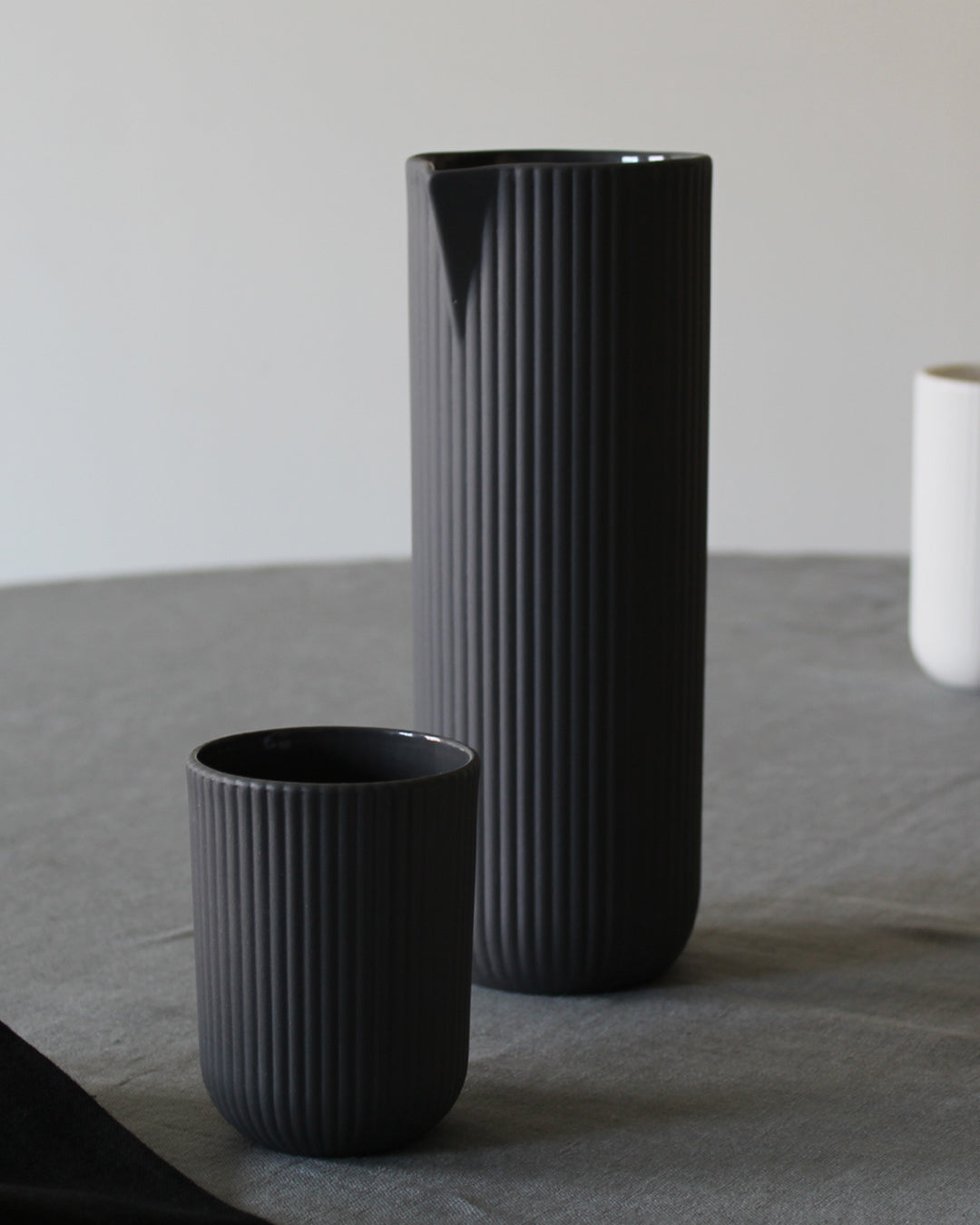 Minimalist dark grey coffee mug Column by Archive Studio on table