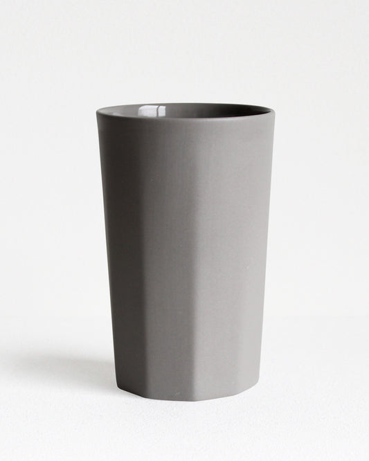 Tall stoneware mug Segmented collection in light grey with textured exterior and glazed interior