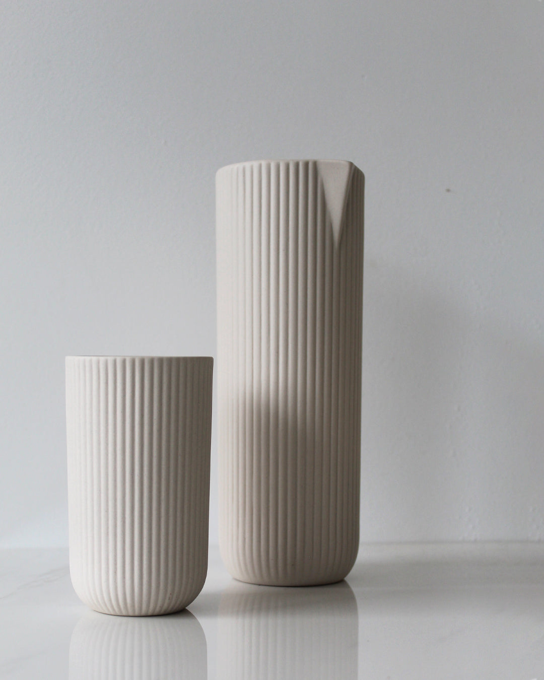 Column carafe in sand, handmade stoneware with glazed interior and unglazed exterior, side view, Archive Studio