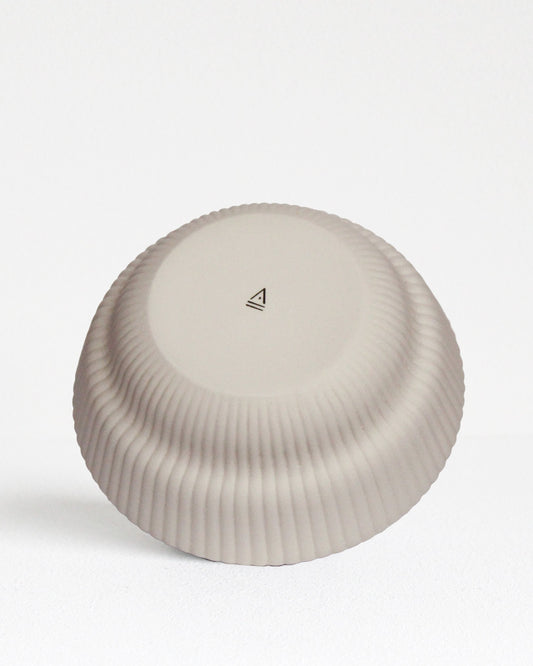 Back view of Column Collection stoneware bowl in sand tone with minimalist design