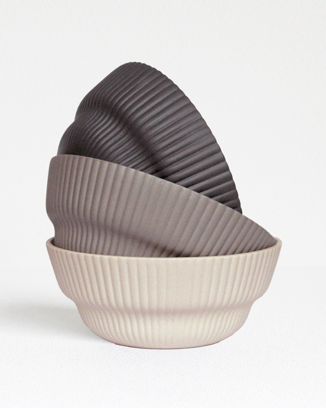 Column Collection stoneware bowls in sand, light grey and dark grey tones, minimalist design