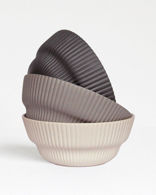Column Collection stoneware bowls in sand, light grey and dark grey tones, minimalist design