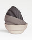 Column Collection stoneware bowls in sand, light grey and dark grey tones, minimalist design