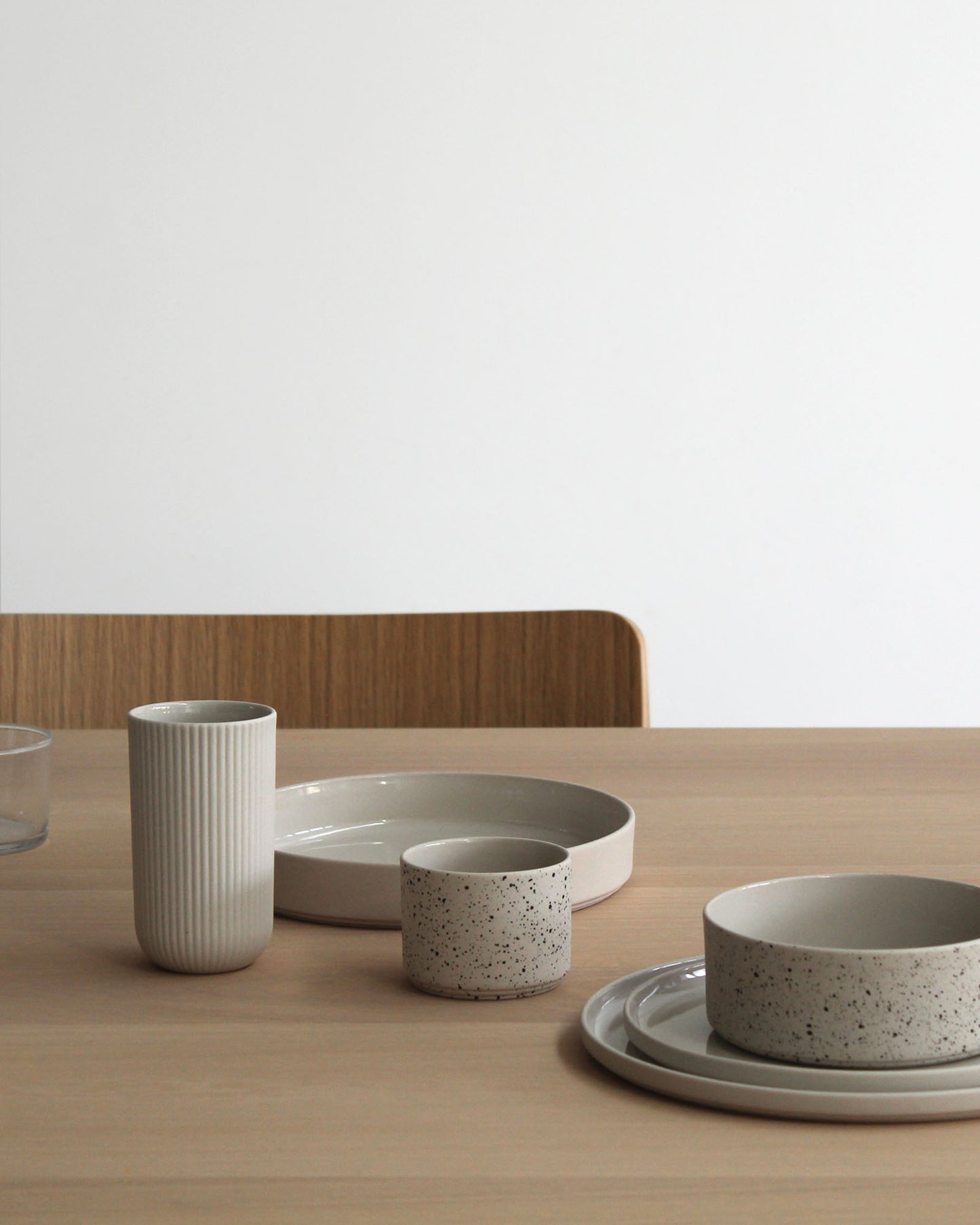 Forme Collection stoneware bowl in sand and speckled finish, glazed inside and unglazed outside, handmade, minimalist design