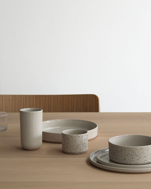 Forme Collection stoneware bowl in sand and speckled finish, glazed inside and unglazed outside, handmade, minimalist design