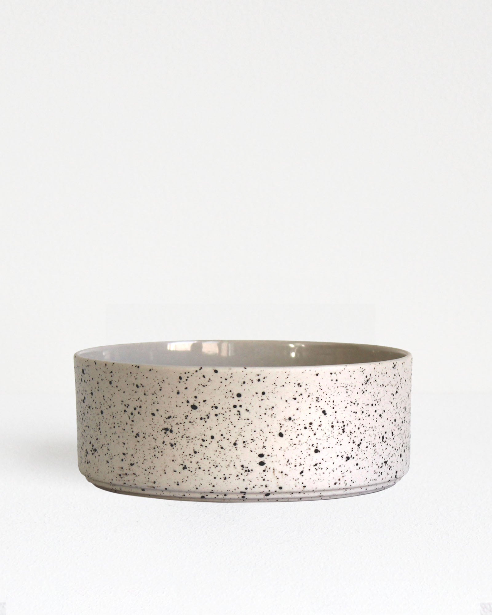 Forme Collection stoneware bowl in sand and speckled finish, glazed inside and unglazed outside, handmade, minimalist design