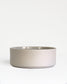 Forme Collection stoneware bowl in solid sand tone, glazed inside and unglazed outside, handmade, minimalist design