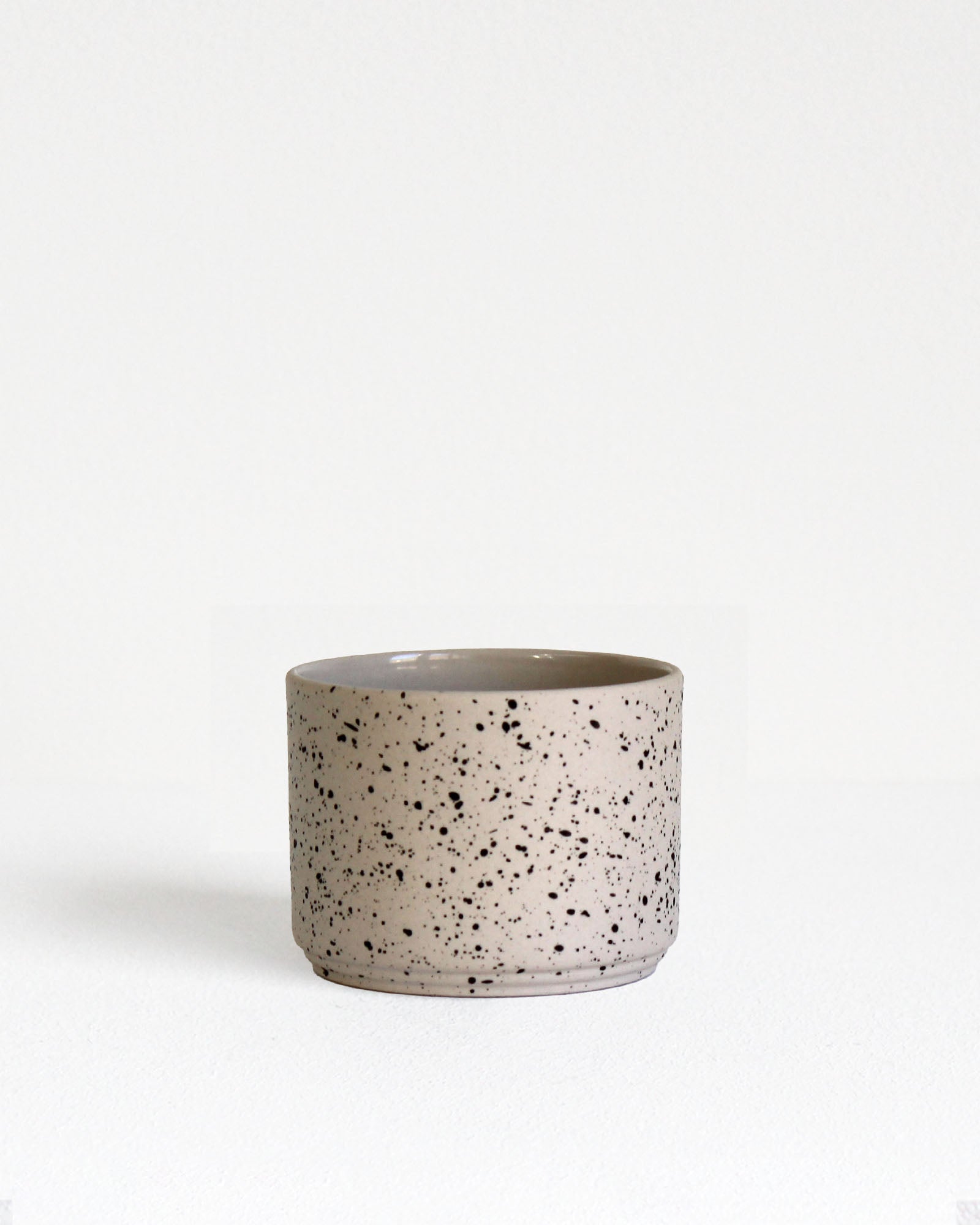 Forme Collection cappuccino mug in sand and speckled stoneware, glazed inside and unglazed outside, handmade, minimalist design
