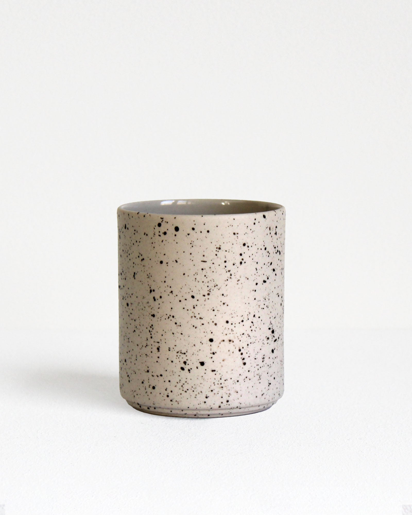 Forme Collection coffee mug in sand and speckled stoneware, glazed inside and unglazed outside, handmade, minimalist design