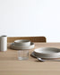 Forme Collection stoneware bowl in solid sand tone, glazed inside and unglazed outside, handmade, minimalist design