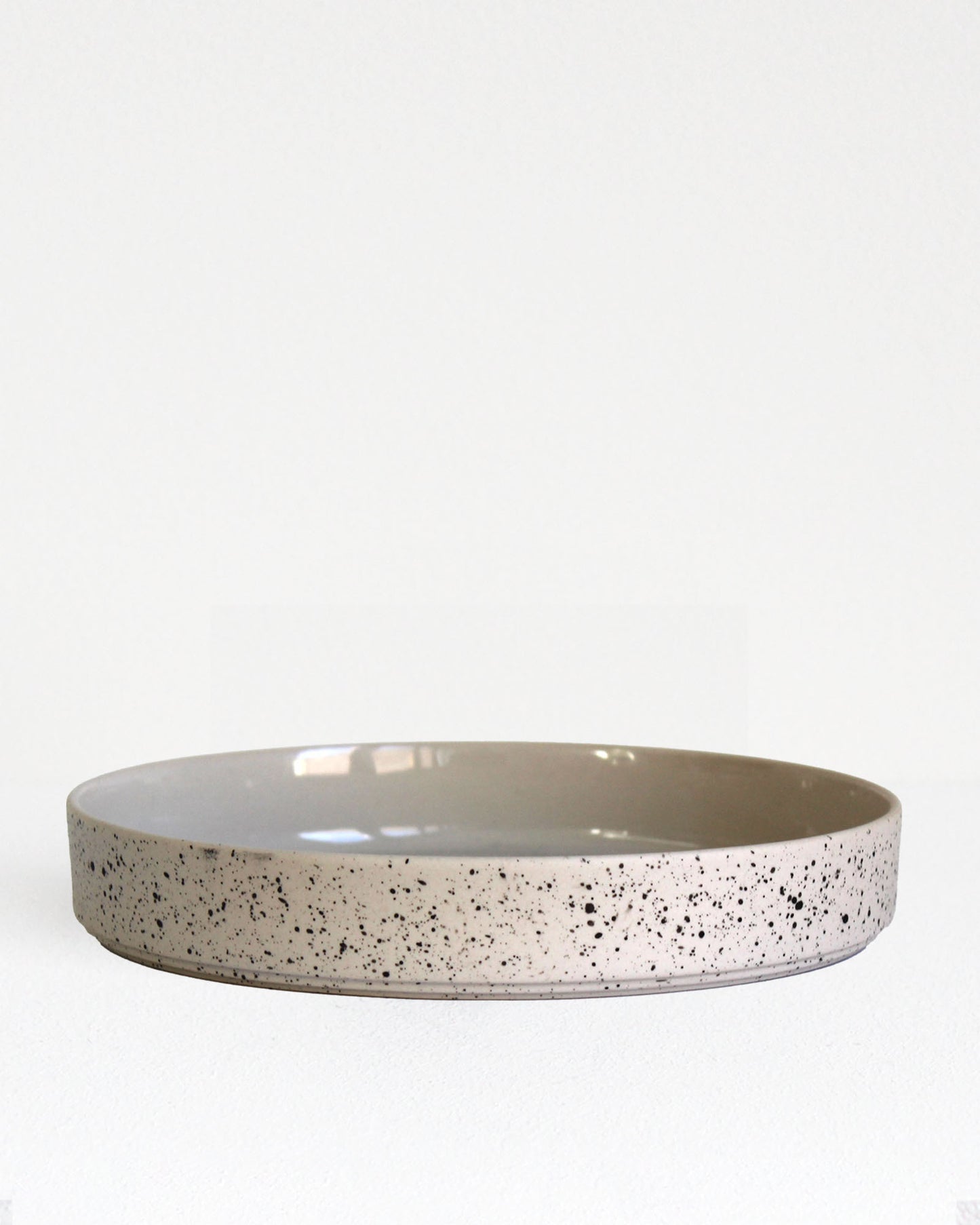 Forme Collection large stoneware bowl in sand and speckled finish, glazed inside and unglazed outside, handmade, minimalist design