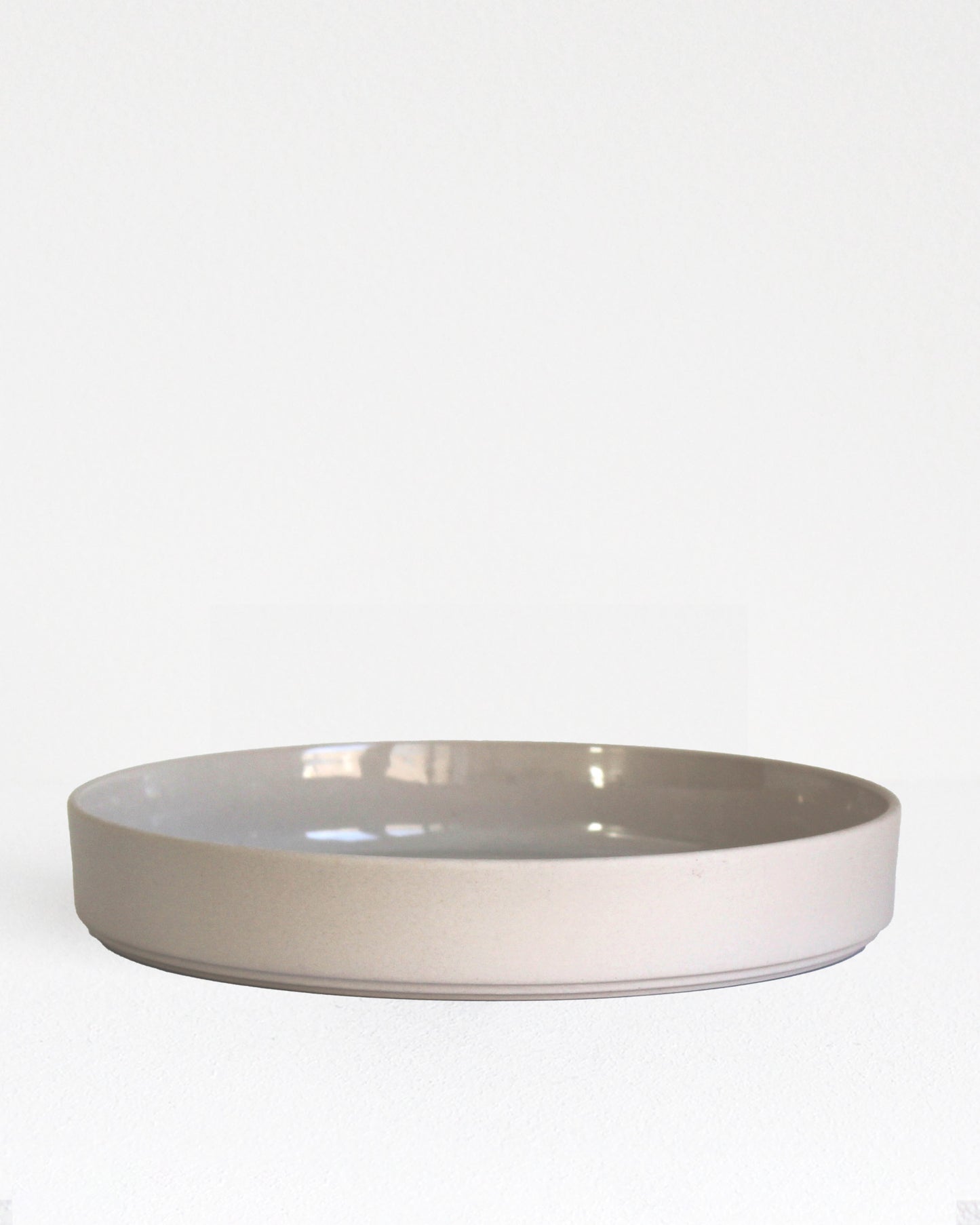 Forme Collection large stoneware bowl in sand finish, glazed inside and unglazed outside, handmade, minimalist design