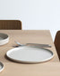 Forme Collection large stoneware plate in solid sand tone, glazed inside and unglazed outside, minimalist design