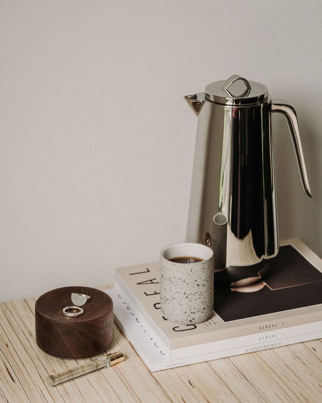 Light grey speckled and white Fundament mug by Archive Studio, perfect for coffee or tea