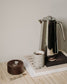 Light grey speckled and white Fundament mug by Archive Studio, perfect for coffee or tea