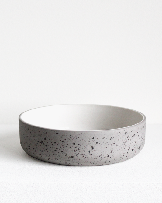 Bowl in light grey speckled and white by Archive Studio with minimalist design