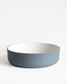 Bowl in teal and white by Archive Studio with minimalist design