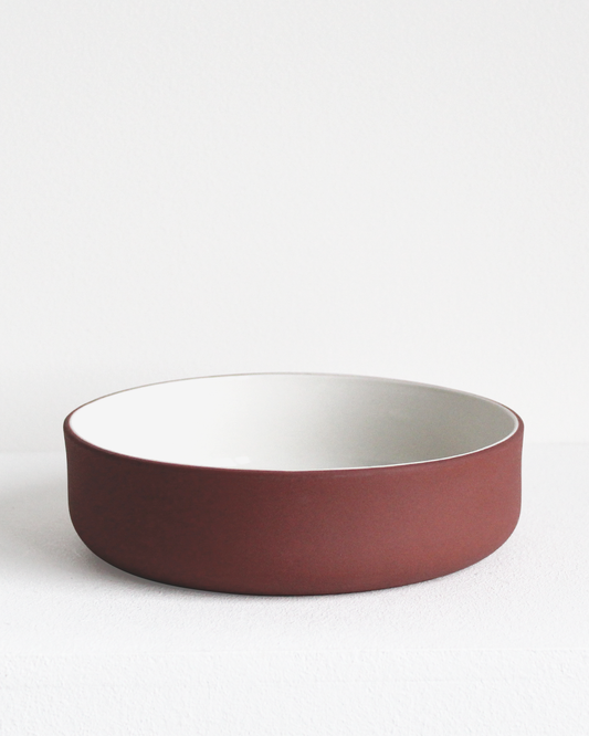 Bowl in terracotta and white by Archive Studio with minimalist design