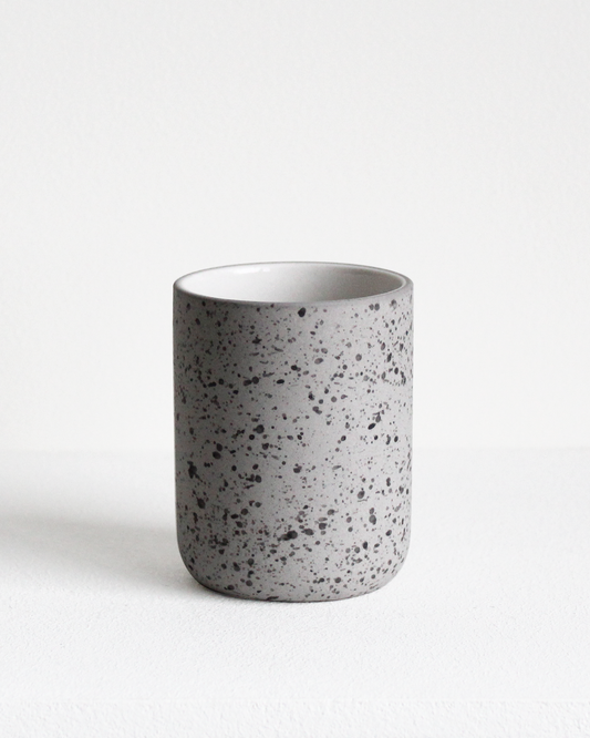 Coffee mug Fundament in light grey speckled and white by Archive Studio with minimalist design