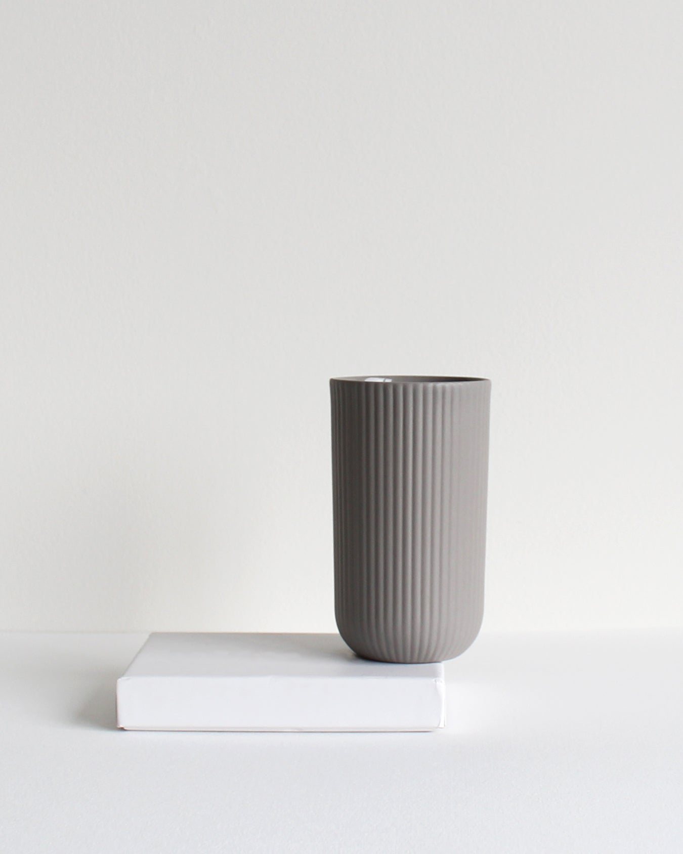Tall light grey mug Column collection styled in a neutral setting