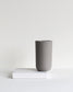 Tall light grey mug Column collection styled in a neutral setting