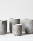 Minimalist light grey speckled/white Coffee mug Fundament by Archive Studio on table