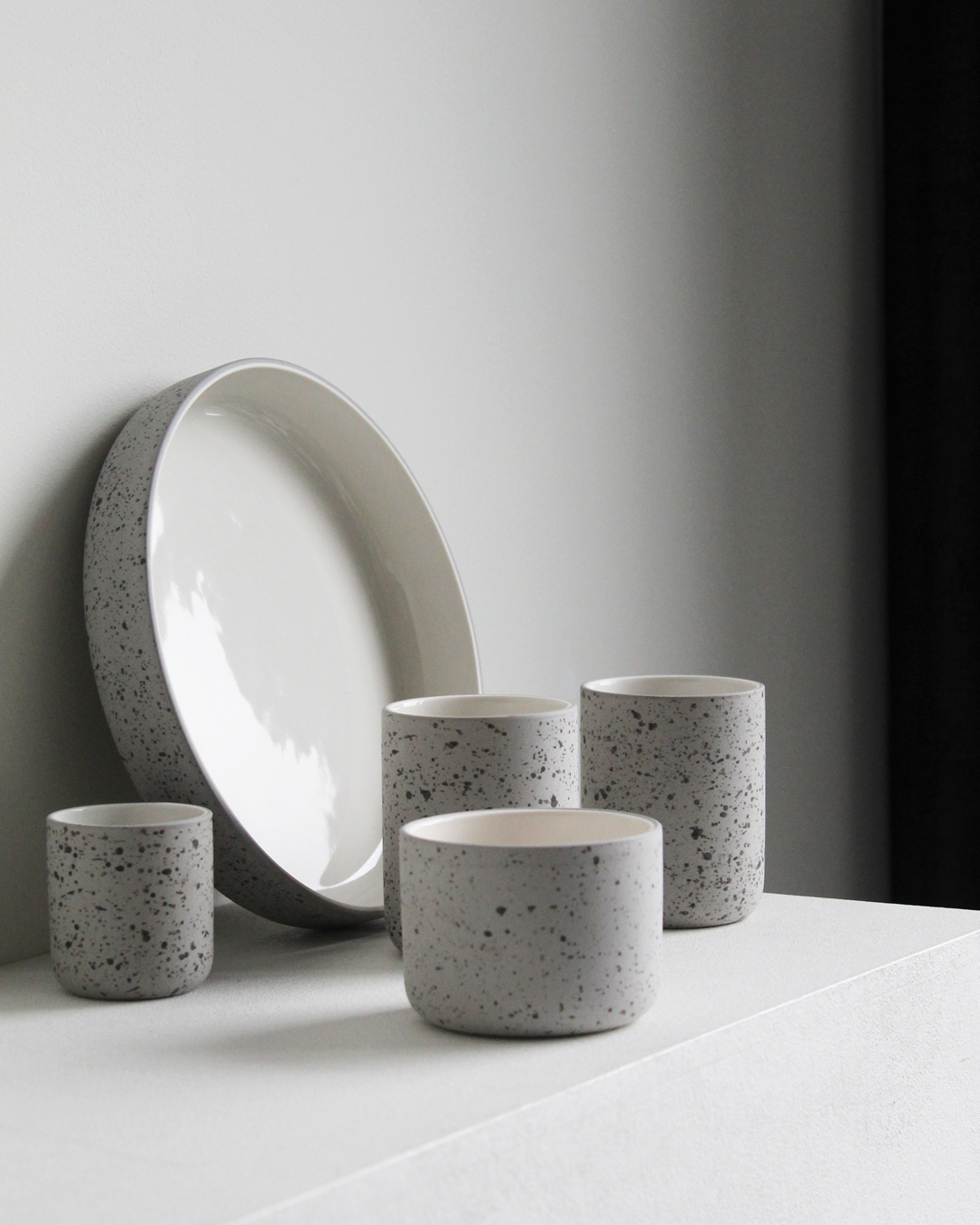 Fundament cappuccino mug in light grey speckled and white by Archive Studio, sleek and stylish