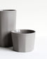 Handmade tall mug in light grey from the Segmented collection with tactile finish