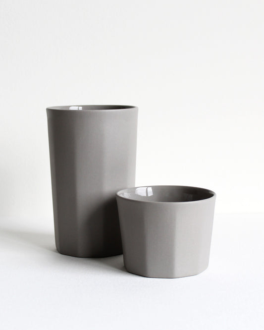 Tall ceramic mug Segmented in light grey with minimalist design and matte texture