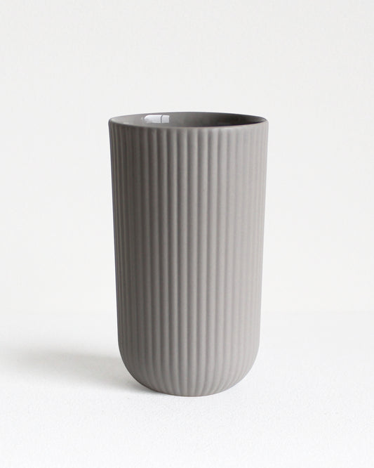 Tall Column stoneware mug in light grey with glazed interior and textured exterior