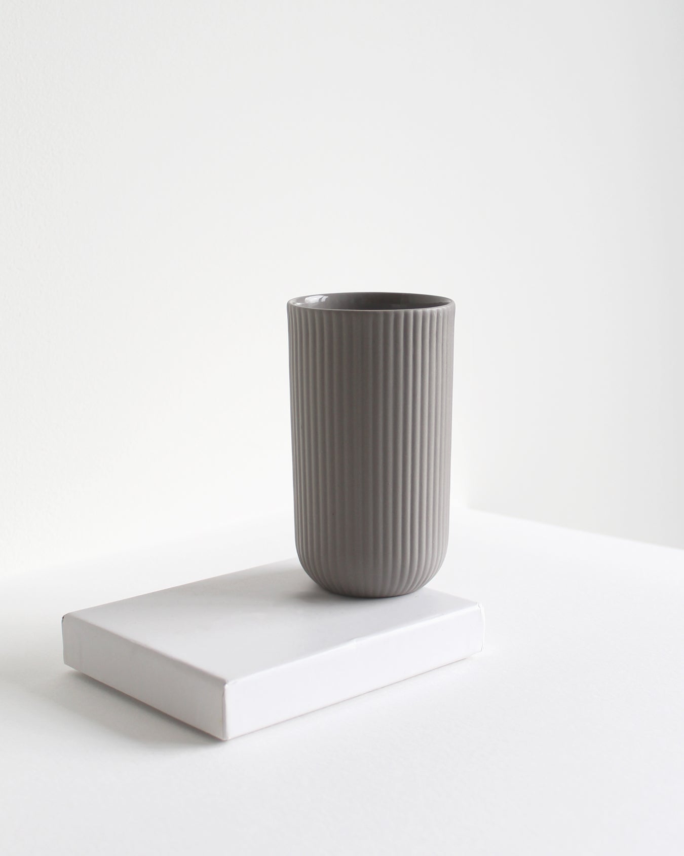 Light grey tall ceramic mug from the Column collection with tactile finish