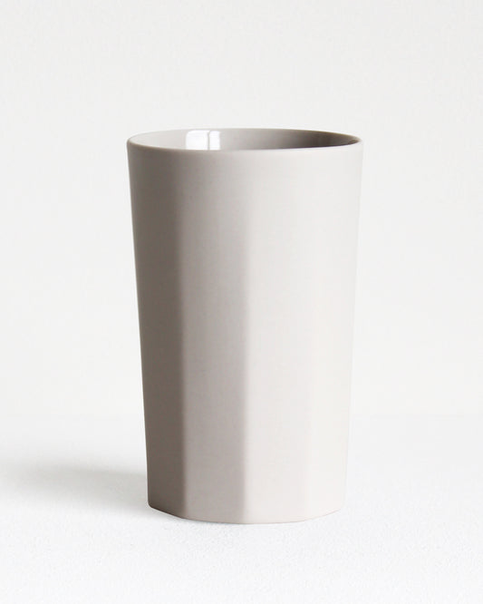 Tall stoneware mug Segmented collection in sand with textured exterior and glazed interior